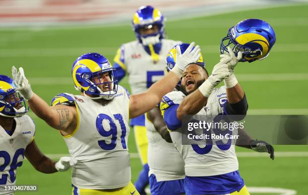 Aaron Donald and Greg Gaines the Los Angeles Rams react during the fourth quarter of Super Bowl LVI against the Cincinnati Bengals at SoFi Stadium on...