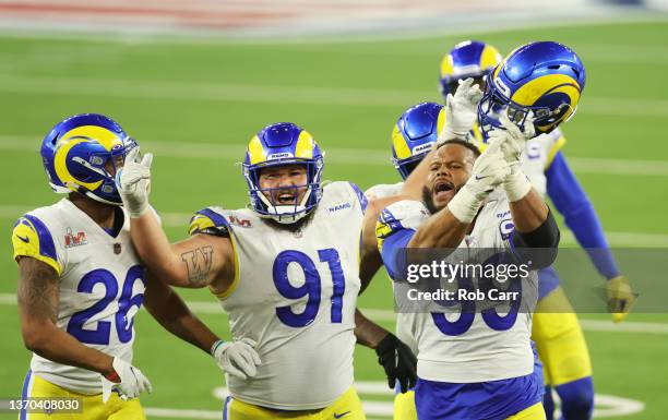 Aaron Donald of the Los Angeles Rams reacts after a sack on Joe Burrow of the Cincinnati Bengals during Super Bowl LVI at SoFi Stadium on February...