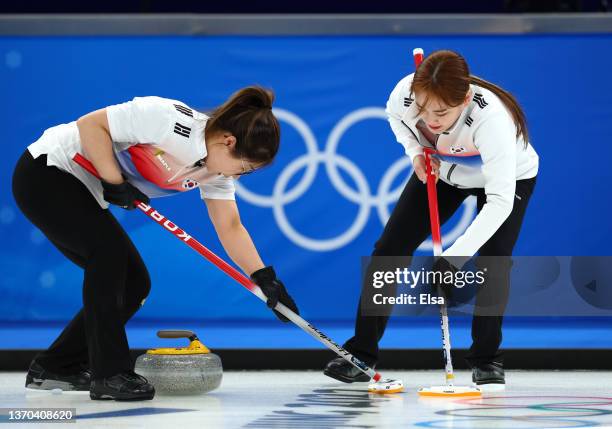 Seon Yeong Kim and Cho Hi Kim of Team Korea compete during the Women’s Curling Round Robin Session against Team United States on Day 10 of the...