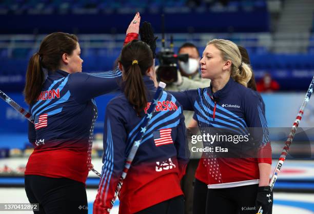 Becca Hamilton and Nina Roth of Team United States high five after winning their Women’s Curling Round Robin Session against Team Korea on Day 10 of...