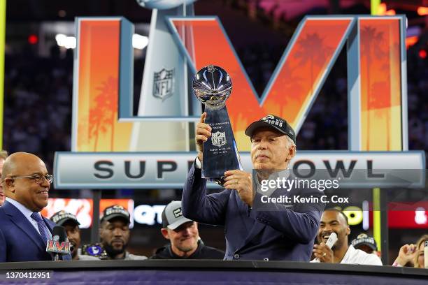 Owner of the Los Angeles Rames Stan Kroenke holds up the Vince Lombardi Trophy after Super Bowl LVI at SoFi Stadium on February 13, 2022 in...