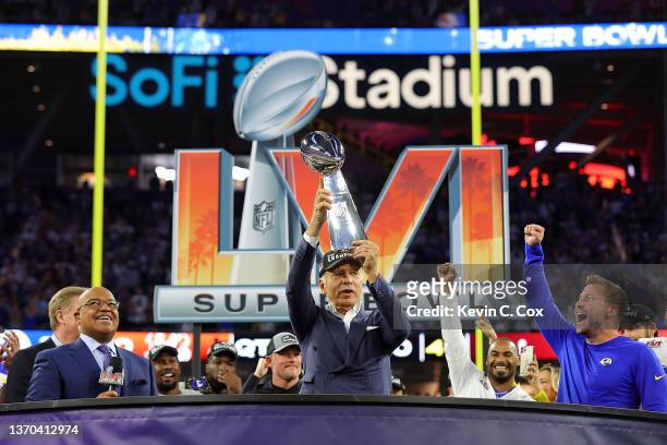 Owner of the Los Angeles Rames Stan Kroenke holds up the Vince Lombardi Trophy after Super Bowl LVI at SoFi Stadium on February 13, 2022 in...