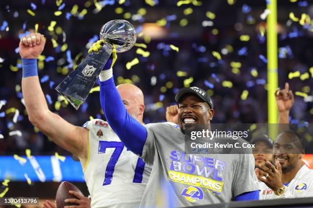 Von Miller of the Los Angeles Rams holds up the Vince Lombardi Trophy after Super Bowl LVI at SoFi Stadium on February 13, 2022 in Inglewood,...