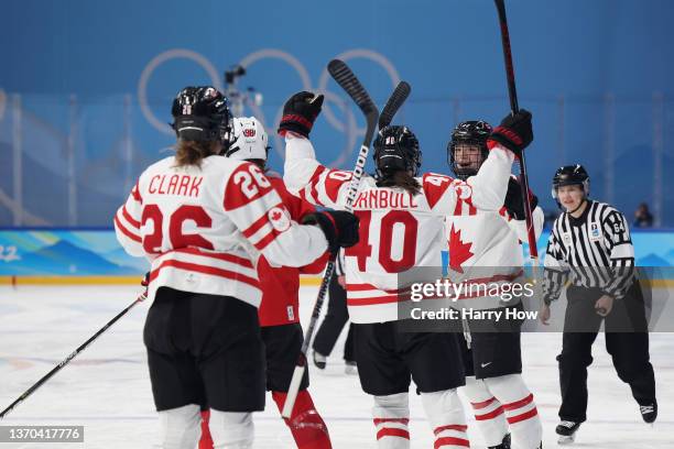 Claire Thompson of Team Canada celebrates with Blayre Turnbull after scoring a goal in the first period during the Women's Ice Hockey Playoff...