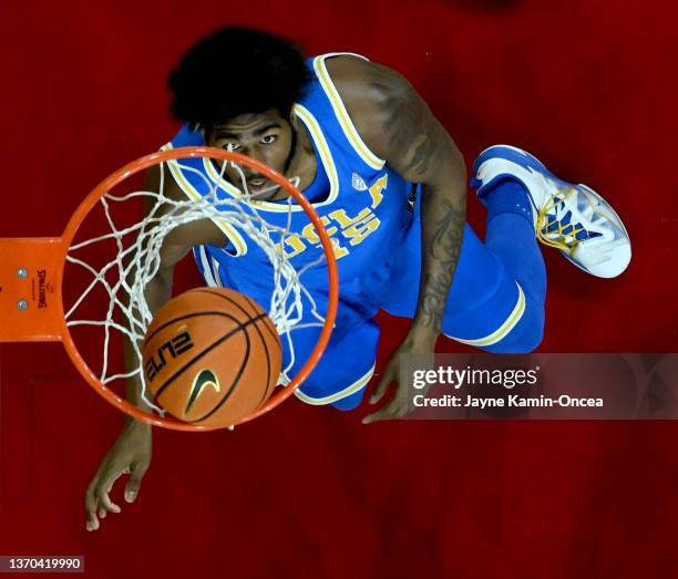 Myles Johnson of the UCLA Bruins watches his shot go through the net during the game against the USC Trojans at Galen Center on February 12, 2022 in...