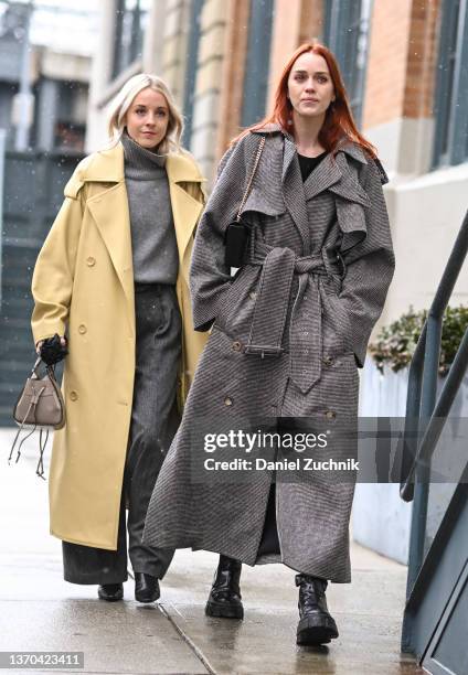 Bianca Lane and Tiernan Cowling are seen outside the Khaite show during New York Fashion Week A/W 2022 on February 13, 2022 in New York City.