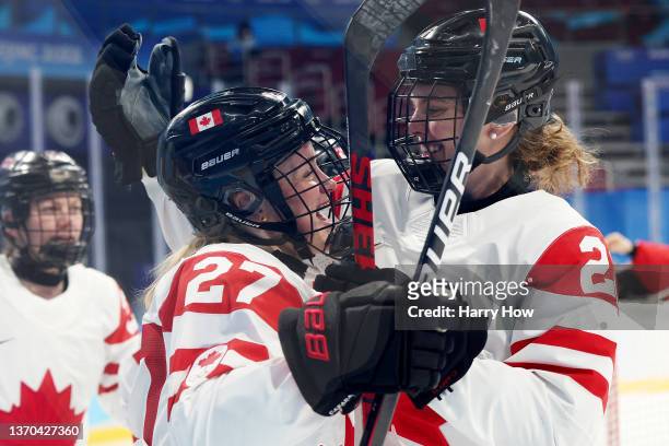 Emma Maltais and Emily Clark of Team Canada celebrate Maltais's goal in the third period during the Women's Ice Hockey Playoff Semifinal match...
