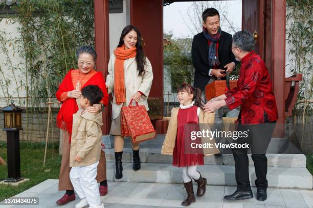 happy family home to reunite with the old man through the new year - 65 year old asian women ストックフォトと画像