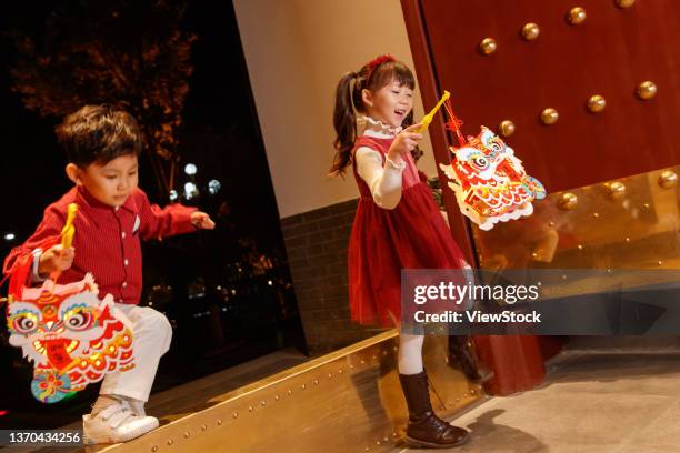 happy boys and girls to celebrate the new year - lantern festival stock pictures, royalty-free photos & images