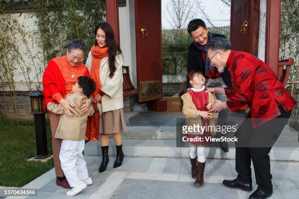 happy family home to reunite with the old man through the new year - 65 year old asian women ストックフォトと画像