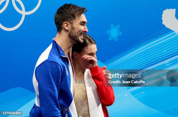 Gold medalists Gabriella Papadakis and Guillaume Cizeron of Team France celebrate at 'kiss and cry' following the Ice Dance Free Dance on day ten of...
