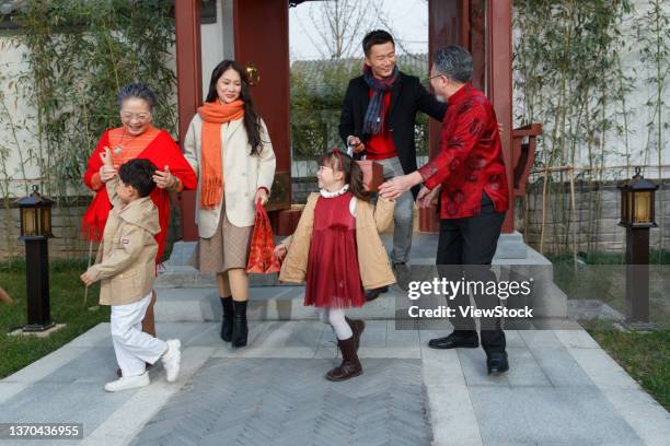 happy family home to reunite with the old man through the new year - 65 year old asian women ストックフォトと画像