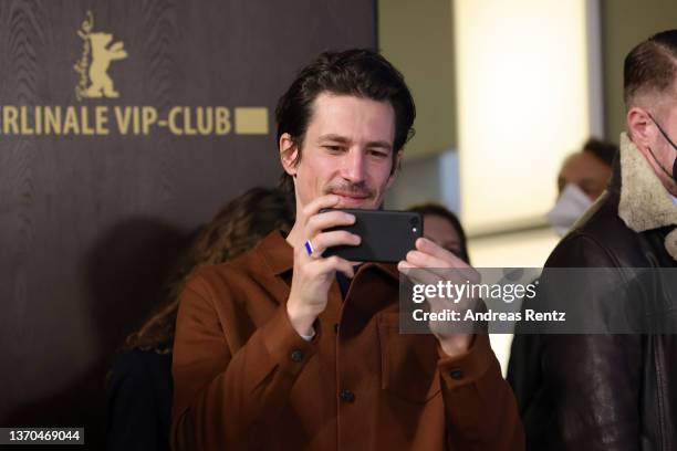 Director Michael Koch takes a picture at the "Drii Winter" photocall during the 72nd Berlinale International Film Festival Berlin at Grand Hyatt...
