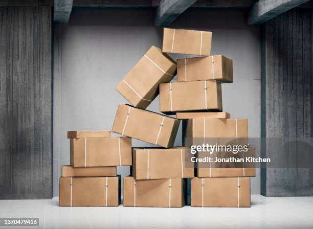 boxes in storage - paket stock-fotos und bilder