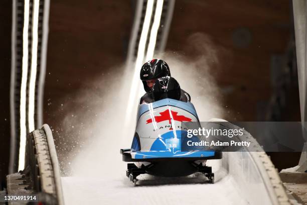 Taylor Austin and Daniel Sunderland of Team Canada slide during the 2-man Bobsleigh Heats on day 10 of Beijing 2022 Winter Olympic Games at National...