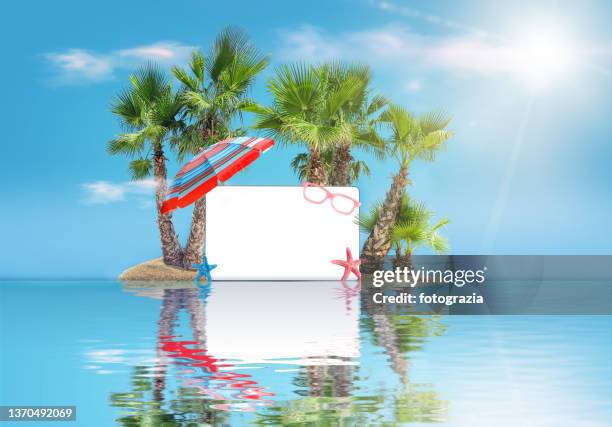 small island in the ocean. palm trees, beach umbrella, sunglasses, starfishes and blank screen. summer vacation concept - beach umbrella isolated stockfoto's en -beelden