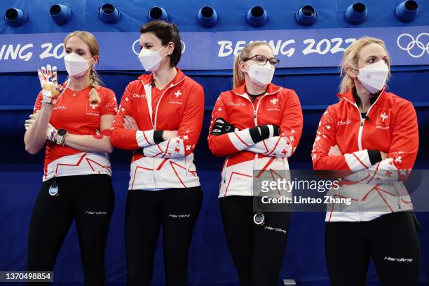 Melanie Barbezat, Esther Neuenschwander, Alina Paetz and Silvana Tirinzoni of Team Switzerland look on prior to competing against Team Sweden during...