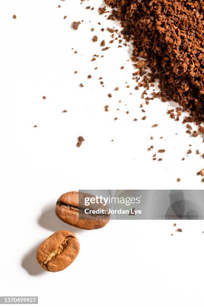 close up of coffee beans and ground coffee - ground coffee stock pictures, royalty-free photos & images