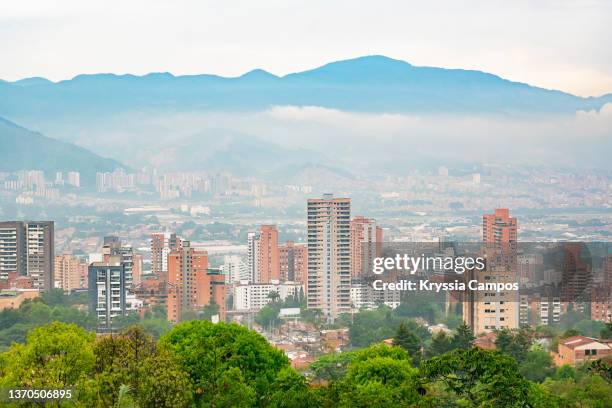 panoramic view of buildings and mountains against sky medellin colombia on a overcast, rainy day - medellin colombia imagens e fotografias de stock