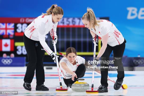 Jocelyn Peterman, Kaitlyn Lawes and Dawn McEwen of Team Canada compete against Team Great Britain during the Women’s Curling Round Robin Session 8 on...