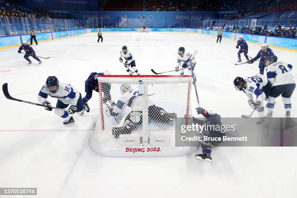 Goalkeeper Anni Keisala of Team Finland and defender Minnamari Tuominen of Team Finland defend the goal against forward Hannah Brandt of Team United...