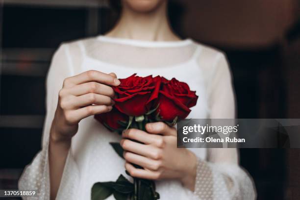 young woman with red roses. - affectionate bildbanksfoton och bilder