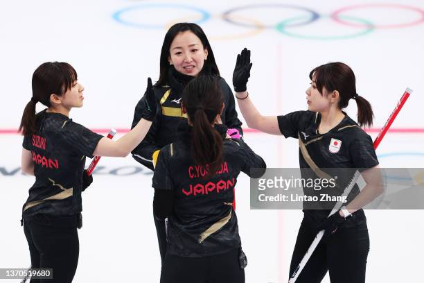 Yumi Suzuki, Satsuki Fujisawa, Chinami Yoshida and Yurika Yoshida of Team Japan interact while competing against Team South Korea during the Women’s...