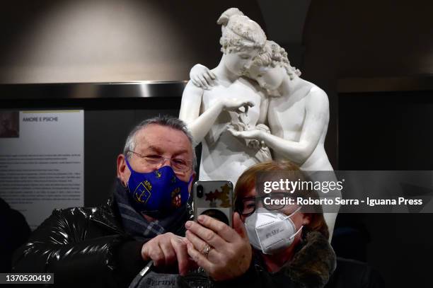 Couple of ancient lovers take a selfie on Valentine's Day with the italian neoclassical artist Antonio Canova's masterpiece "Amore E Psiche" during...