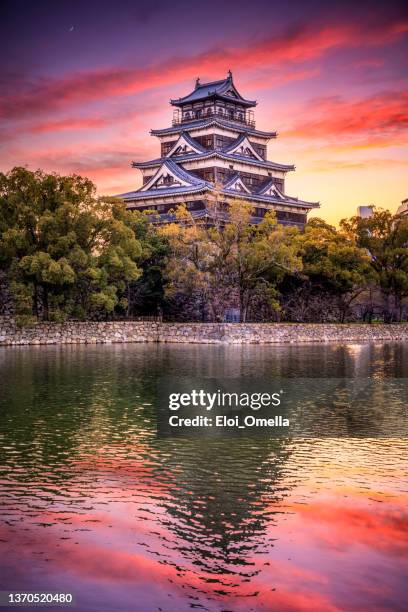 hiroshima castle at sunset. japan - hiroshima castle stock pictures, royalty-free photos & images