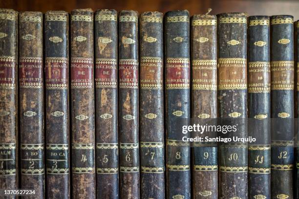 close-up of leather-bound vintage agriculture encyclopaedia - enciclopedia stock pictures, royalty-free photos & images
