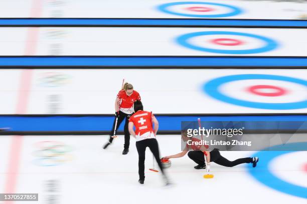 Alina Paetz, Esther Neuenschwander and Melanie Barbezat of Team Switzerland compete against Team Sweden during the Women’s Curling Round Robin...
