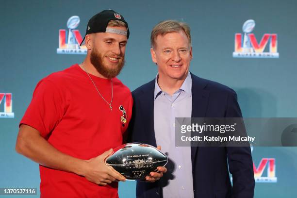 Cooper Kupp of the Los Angeles Rams and NFL Commissioner Roger Goodell pose for a picture with the Pete Rozelle Trophy during the Super Bowl LVI head...