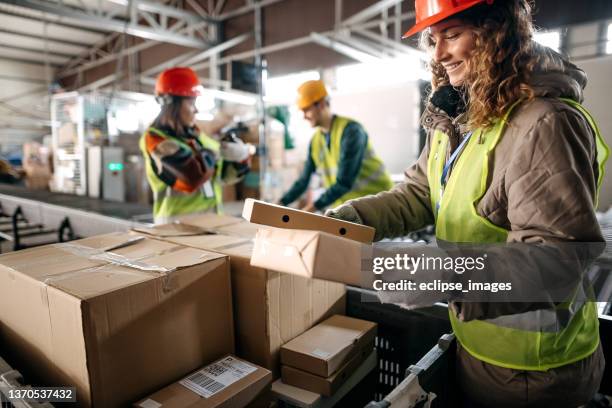 valuable workers in the warehouse - warehouse worker stock pictures, royalty-free photos & images