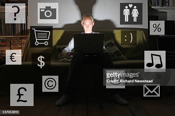 young man using laptop - front camera icon stock-fotos und bilder