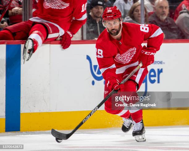 Sam Gagner of the Detroit Red Wings skates up ice with the puck against the Philadelphia Flyers during the third period of an NHL game at Little...