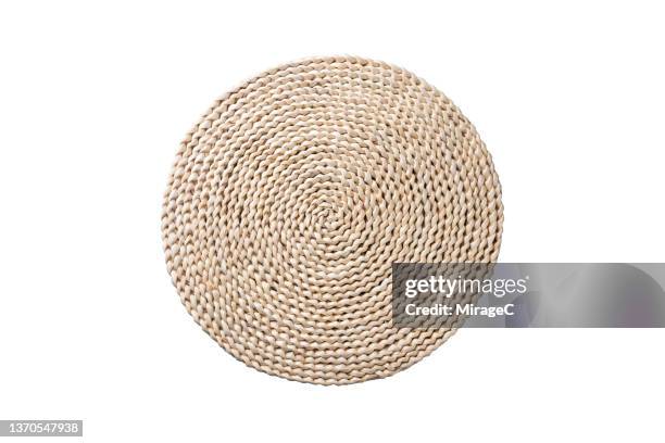 weave straw place mat isolated on white - tischset stock-fotos und bilder