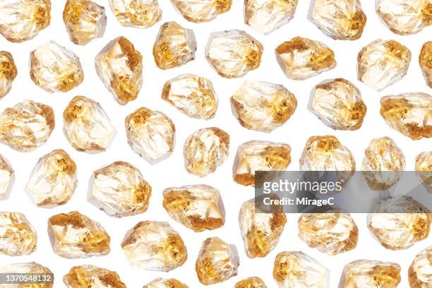 yellow quartz crystal pattern - rough cut stock pictures, royalty-free photos & images