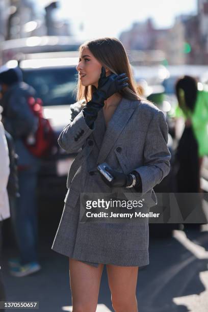 Sofia Eve wearing a grey oversize blazer is seen outside Bronx and Banco during New York Fashion Week on February 11, 2022 in New York City.