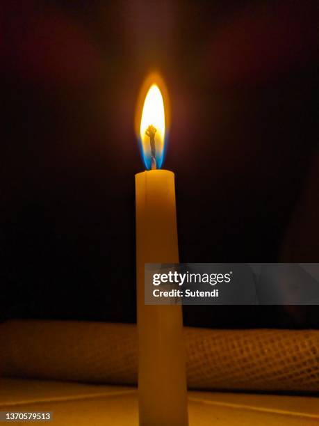 a candle - dark room foto e immagini stock