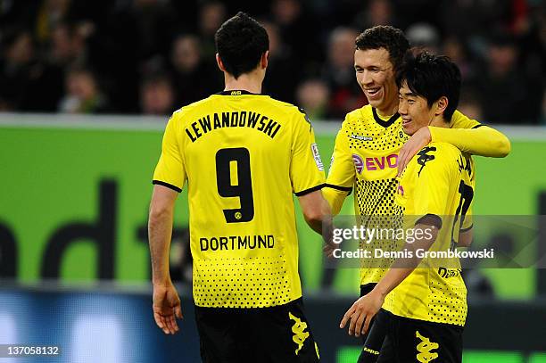 Shinji Kagawa of Dortmund celebrates with teammates after scoring his team's opening goal during the Stadtwerke Duesseldorf Wintercup 2012 match...