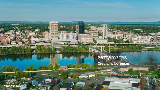 downtown springfield, massachusetts from west springfield with connecticut river-aerial - springfield massachusetts stock pictures, royalty-free photos & images