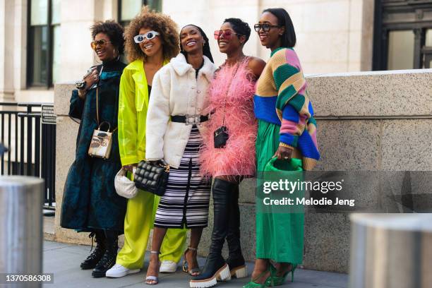 Monica Awe-Etuk, Karen Blanchard, Aissata Diallo, and Jenny’ Naylor pose in colorful outfits and bags at the Victor Glemaud show at Moynihan Train...