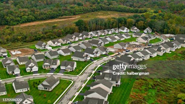residential community with construction in mansfield township, new jersey-aerial - small town community stock pictures, royalty-free photos & images