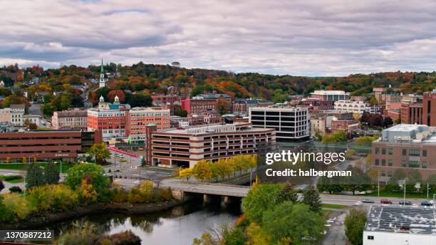 drone shot of the penobscot river flowing through bangor, me - bangor maine stock pictures, royalty-free photos & images