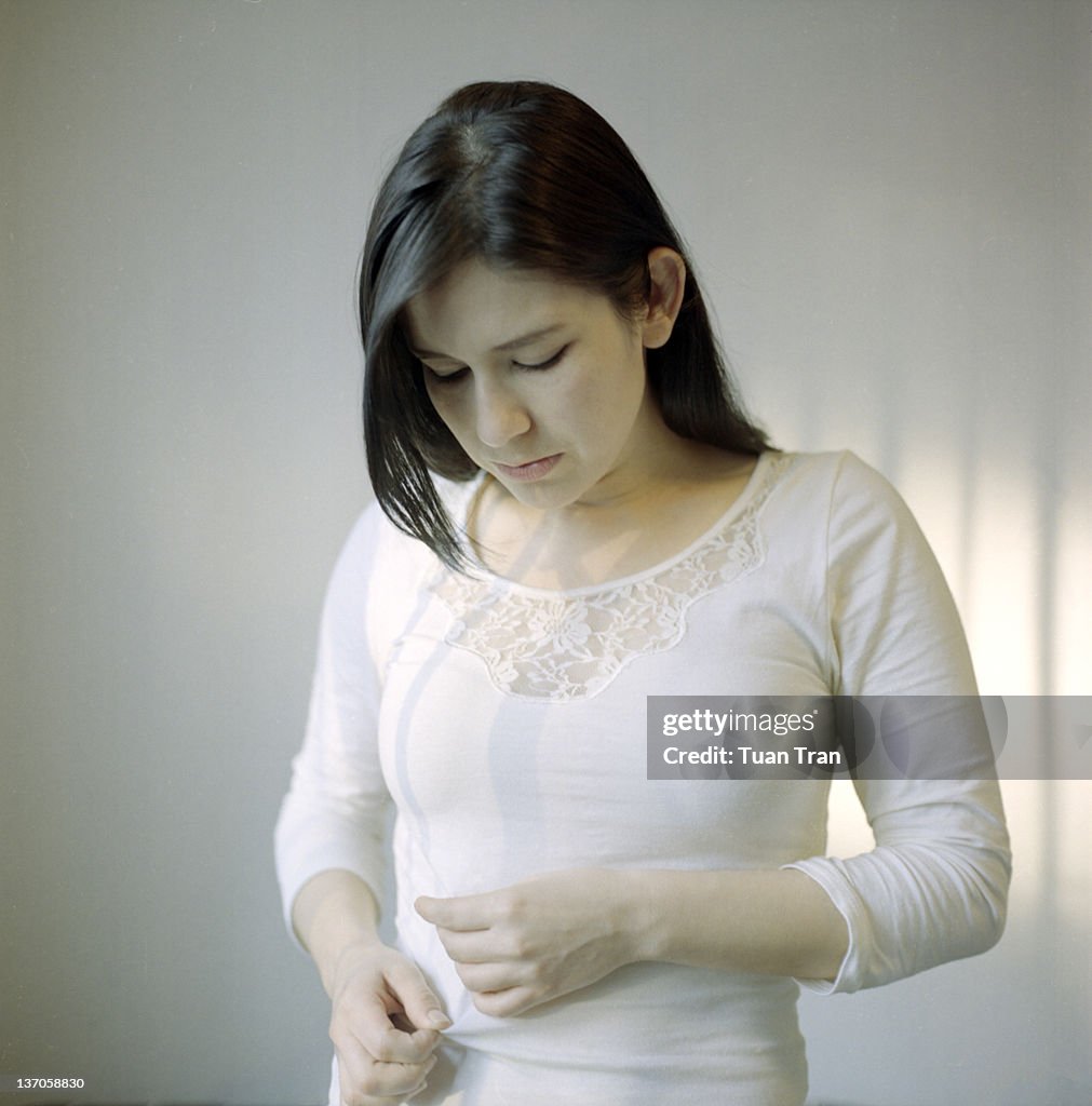 Woman fixing her shirt