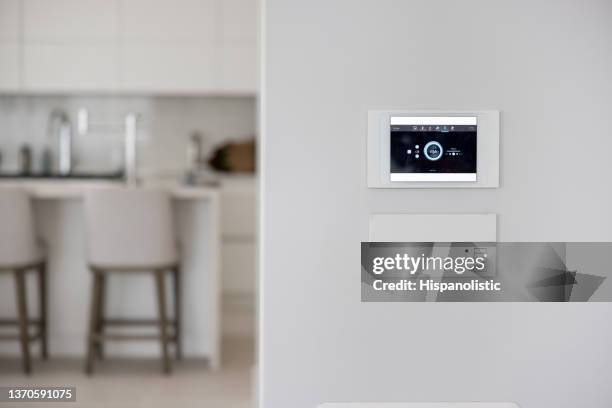 close-up on a home automated system controller - burglar alarm stock pictures, royalty-free photos & images