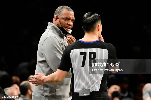 Head coach Alvin Gentry of the Sacramento Kings speaks with referee Evan Scott during the first half against the Brooklyn Nets at Barclays Center on...