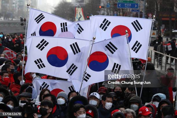 Supporters await the arrival of presidential candidate Yoon Suk-yeol of the main opposition People Power Party during during a presidential election...
