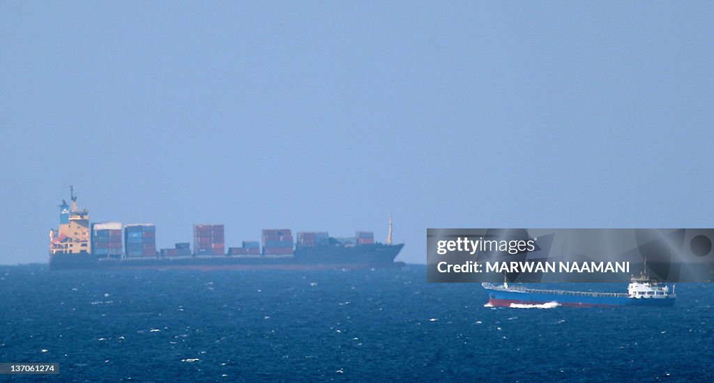 A cargo ship cruises towards the Strait