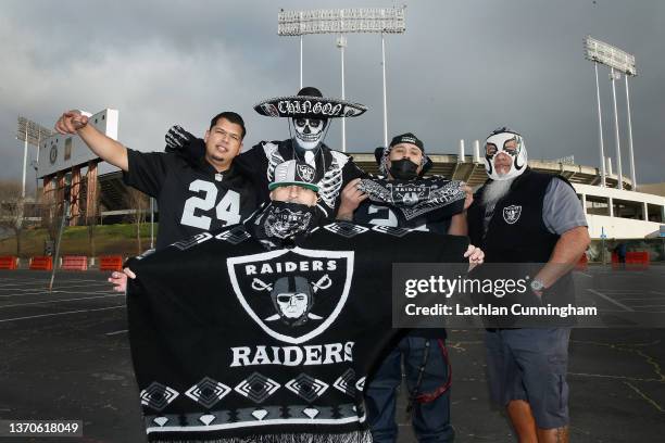 Raiders fans pose for a photo before a memorial service held for Hall of Fame NFL coach and broadcaster John Madden at RingCentral Coliseum on...